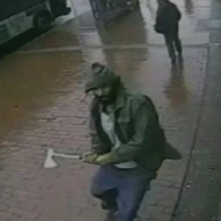 Ax wielding man attacks NYPD officers.